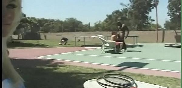  Red head slut gets double penetrated by black shlong and white dick on tennis court while sexy blonde watches then joins in after masturbating